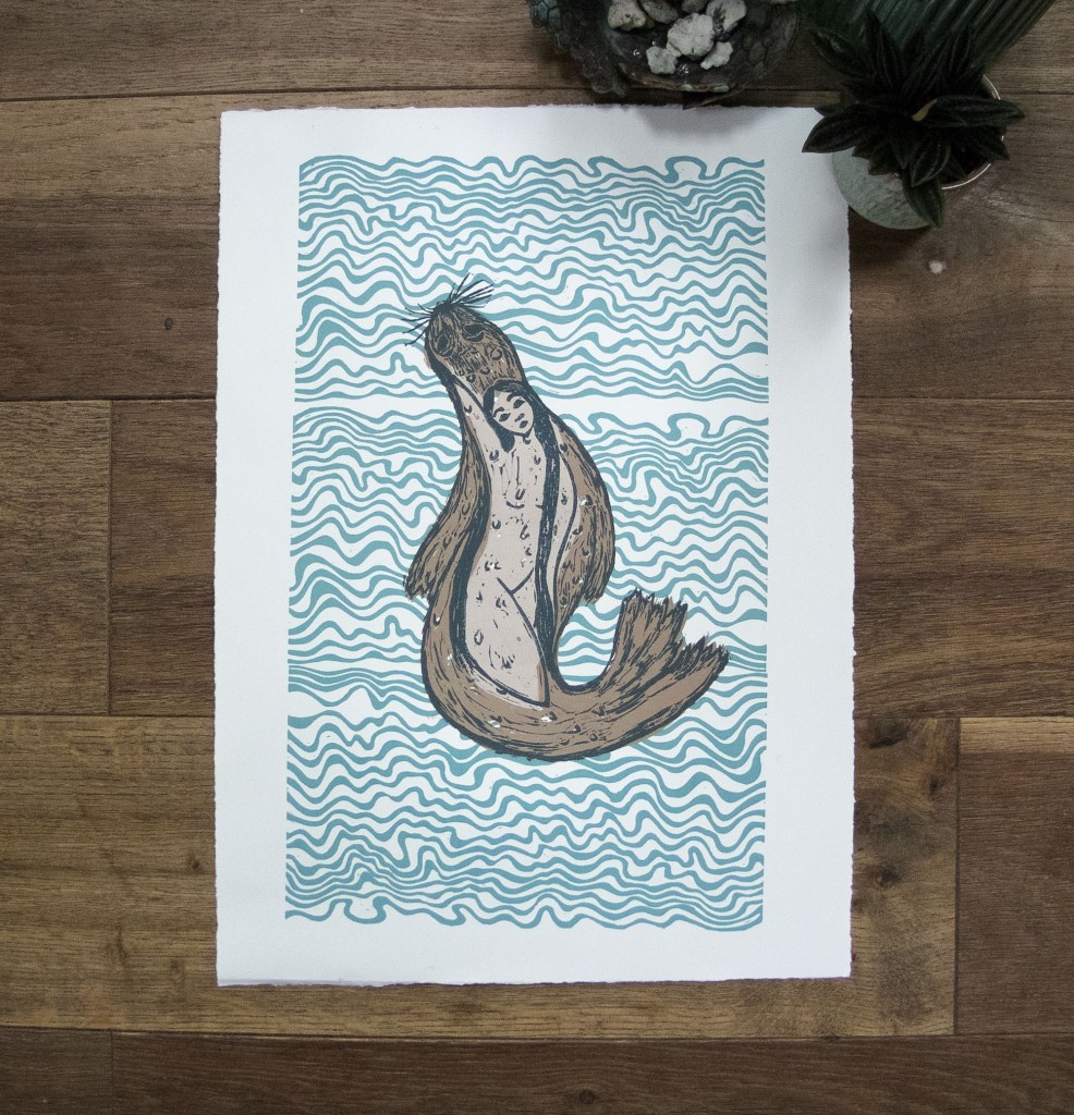 linocut print of abstrast water with a women inside a seal, a selkie
