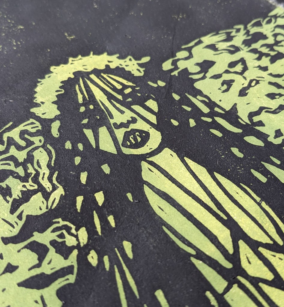 A close-up illustration of Jenny Greenteeth, a mythical creature from English folklore, depicted with flowing hair and a haunting expression, surrounded by dark and textured elements resembling water.