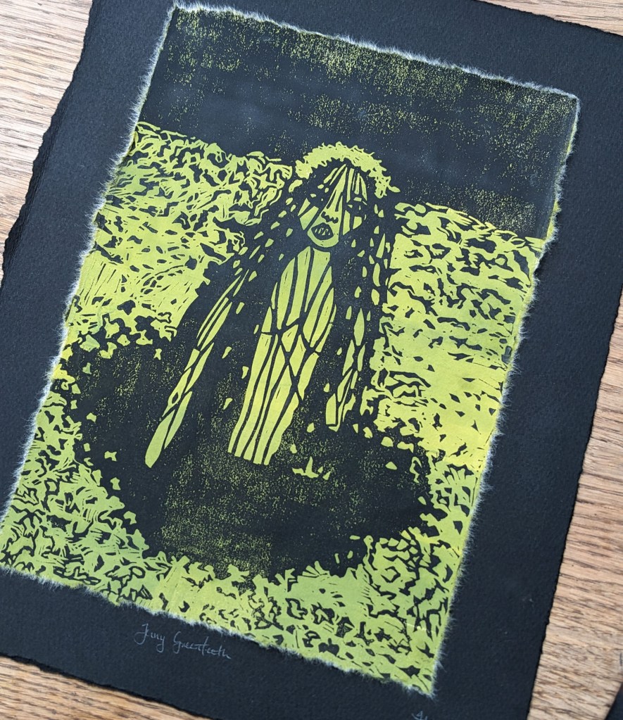 An linocut print of Jenny Greenteeth, an English fairy, depicted with long hair and a haunting expression, set against a background of ponds and dark vegetation.