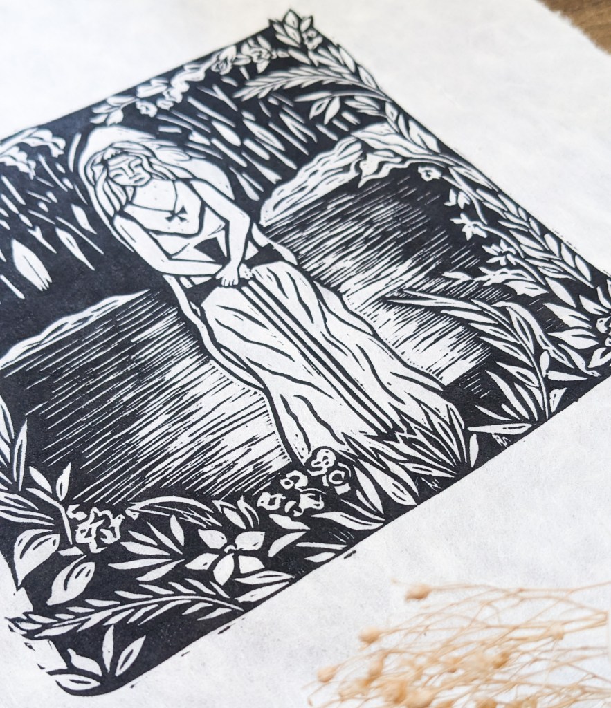 lady of the lake square linocut print of a woman in a lake holding a sword. black and white