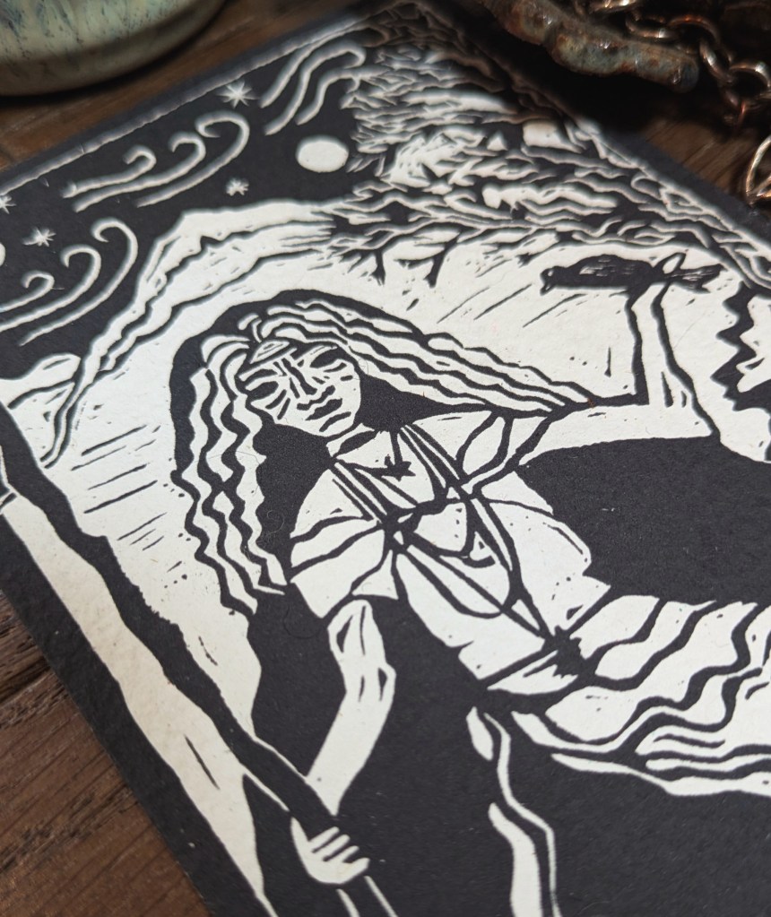 up close image of the cailleach linocut oracle card
