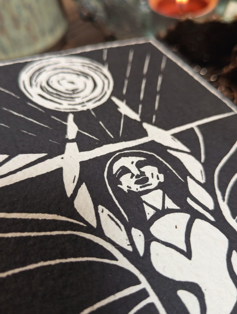 detailed close up of linocut print on oracle card Morgana