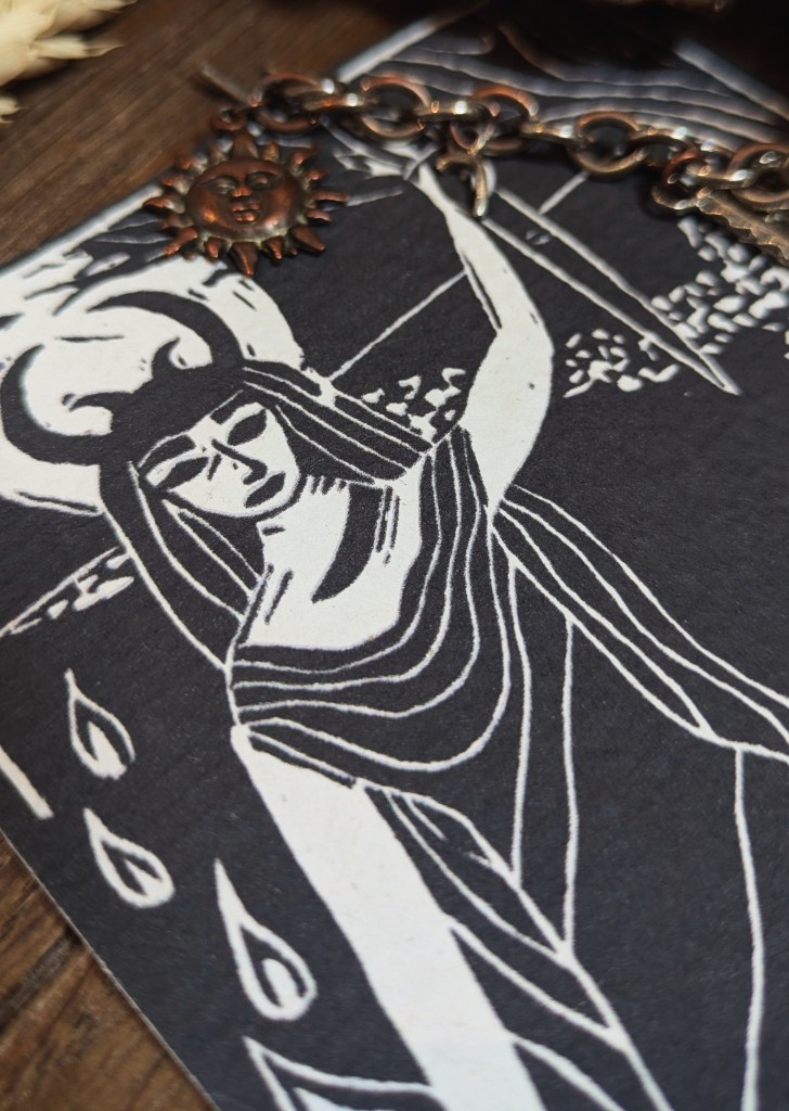 An artistic representation of Hecate, the triple goddess, depicting her with horns and flowing robes against a dark background, symbolizing her connection to magic and the underworld.